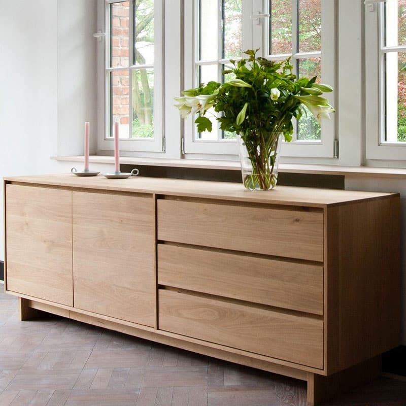 Ethnicraft Wave Sideboard by Constance Guisset Oak Lifeshot 02 Olson and Baker - Designer & Contemporary Sofas, Furniture - Olson and Baker showcases original designs from authentic, designer brands. Buy contemporary furniture, lighting, storage, sofas & chairs at Olson + Baker.