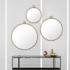 Gubi Randaccio Wall Mirror by Gio Ponti life 1 Olson and Baker - Designer & Contemporary Sofas, Furniture - Olson and Baker showcases original designs from authentic, designer brands. Buy contemporary furniture, lighting, storage, sofas & chairs at Olson + Baker.