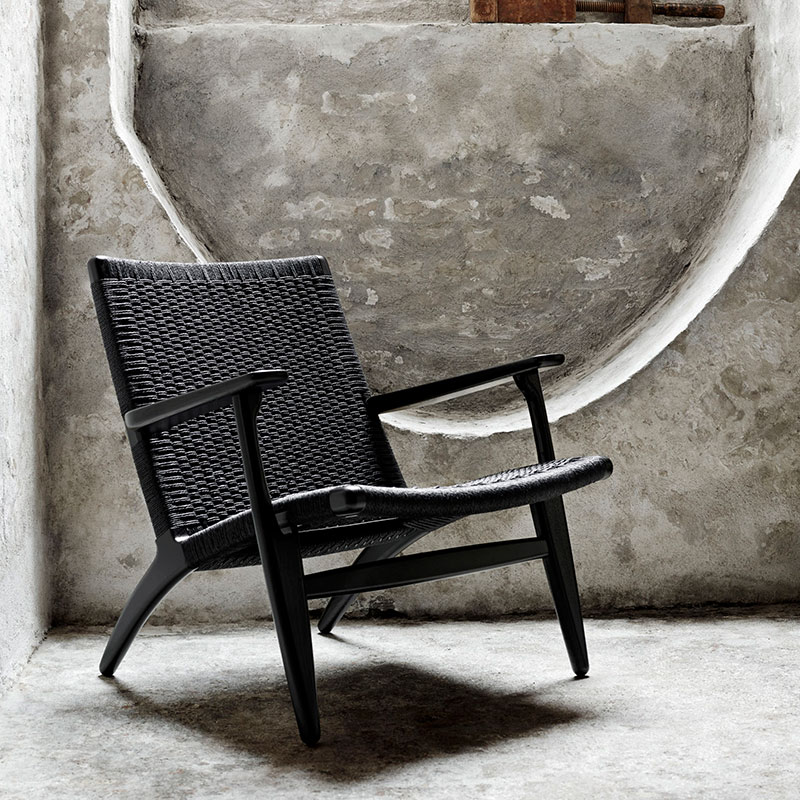Carl Hansen CH25 Lounge Chair by Hans Wegner life 2 Olson and Baker - Designer & Contemporary Sofas, Furniture - Olson and Baker showcases original designs from authentic, designer brands. Buy contemporary furniture, lighting, storage, sofas & chairs at Olson + Baker.
