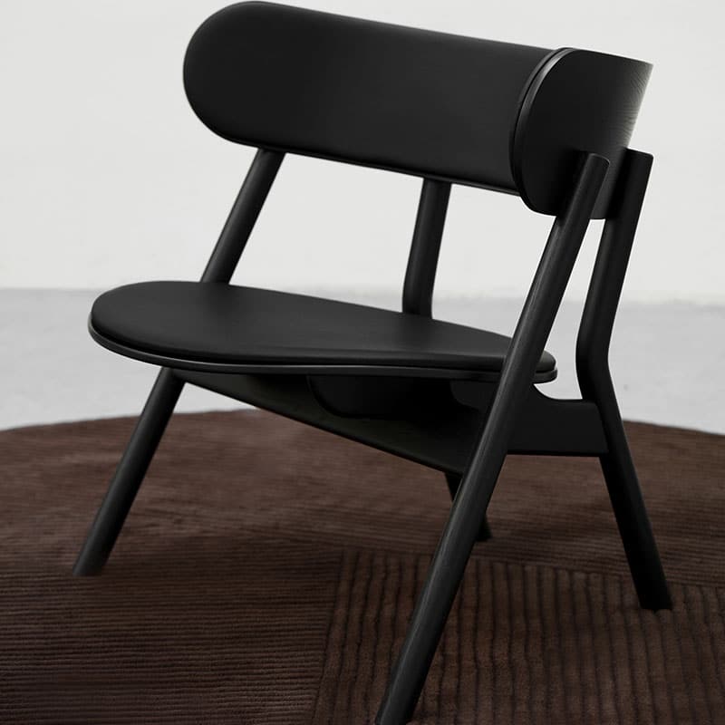 Northern_Oaki_Lounge_Chair_with_Seat_and_Back_Padding_in_Black_Painted_Oak_by Stine_Aas_Lifeshot_01 Olson and Baker - Designer & Contemporary Sofas, Furniture - Olson and Baker showcases original designs from authentic, designer brands. Buy contemporary furniture, lighting, storage, sofas & chairs at Olson + Baker.