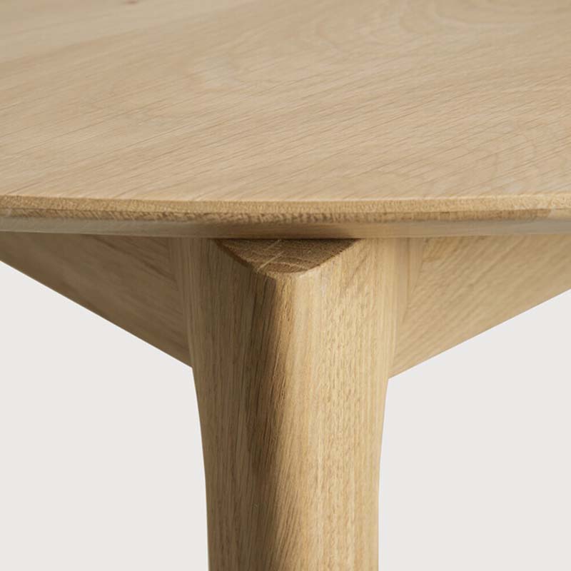 Case Furniture - Oak Bok Round Extendable Dining Table by Alain van Havre - Closeup 02 Olson and Baker - Designer & Contemporary Sofas, Furniture - Olson and Baker showcases original designs from authentic, designer brands. Buy contemporary furniture, lighting, storage, sofas & chairs at Olson + Baker.