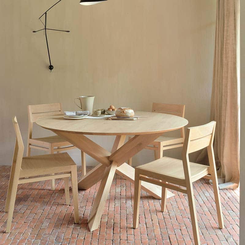 Ethnicraft - Circle Dining Table by Alain van Havre - Lifestyle 01 Olson and Baker - Designer & Contemporary Sofas, Furniture - Olson and Baker showcases original designs from authentic, designer brands. Buy contemporary furniture, lighting, storage, sofas & chairs at Olson + Baker.