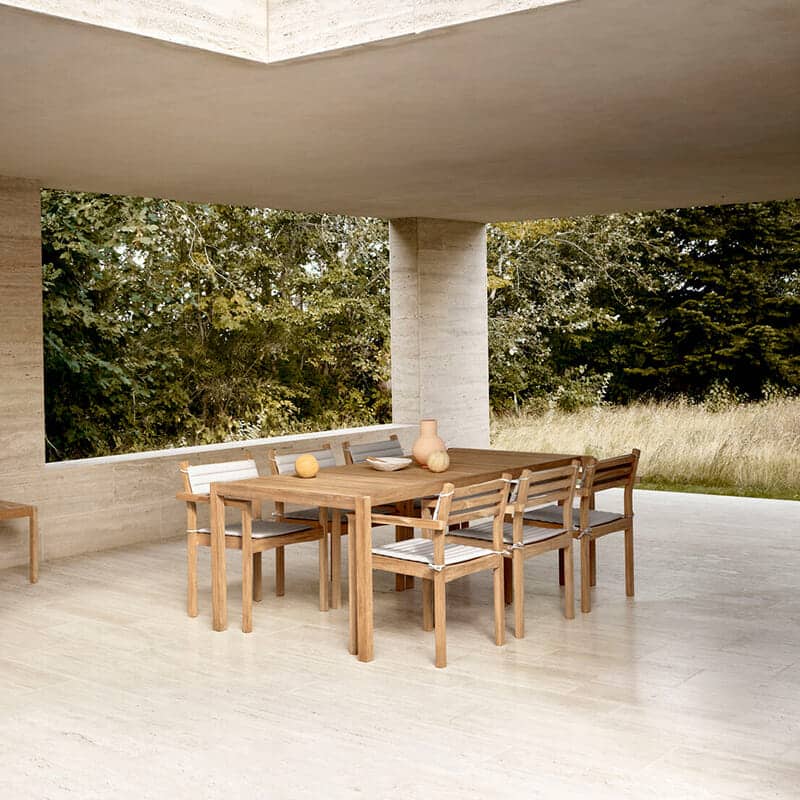 Carl Hansen - AH502 Outdoor Dining Chair with Armrest - Lifestyle Image 02 Olson and Baker - Designer & Contemporary Sofas, Furniture - Olson and Baker showcases original designs from authentic, designer brands. Buy contemporary furniture, lighting, storage, sofas & chairs at Olson + Baker.