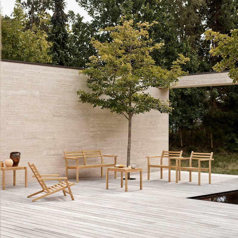 Carl Hansen - AH601 Outdoor Lounge Chair - Lifestyle Image 02 Olson and Baker - Designer & Contemporary Sofas, Furniture - Olson and Baker showcases original designs from authentic, designer brands. Buy contemporary furniture, lighting, storage, sofas & chairs at Olson + Baker.