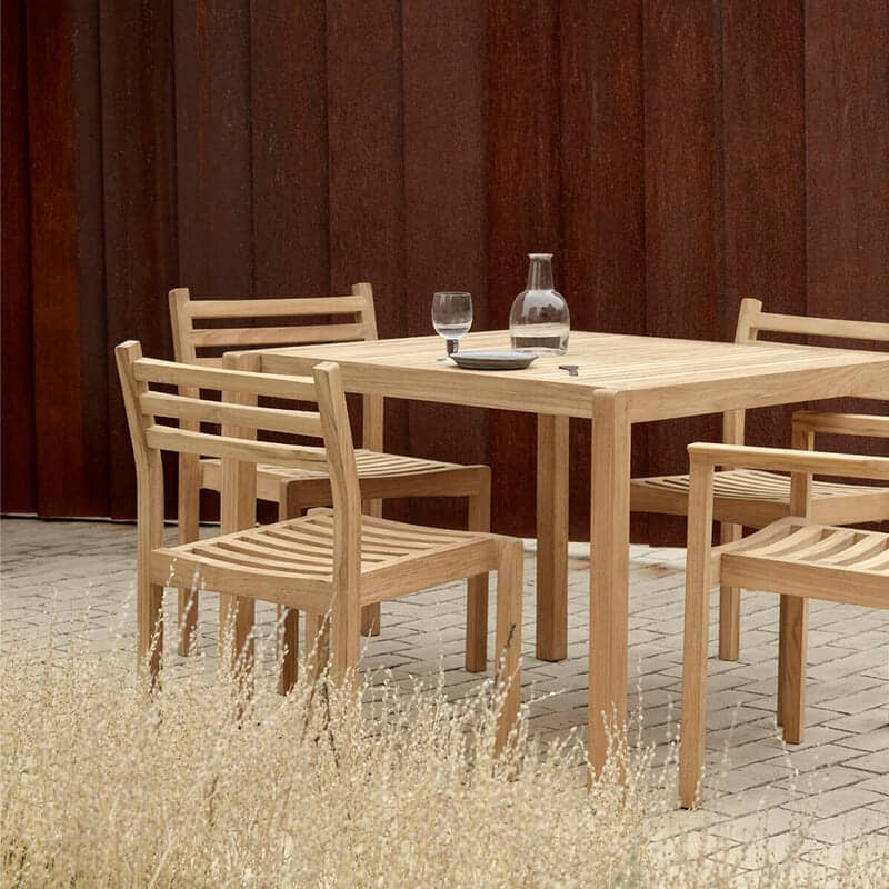 Carl Hansen - AH902 Outdoor Dining Table Square - Lifestyle Image 01 Olson and Baker - Designer & Contemporary Sofas, Furniture - Olson and Baker showcases original designs from authentic, designer brands. Buy contemporary furniture, lighting, storage, sofas & chairs at Olson + Baker.