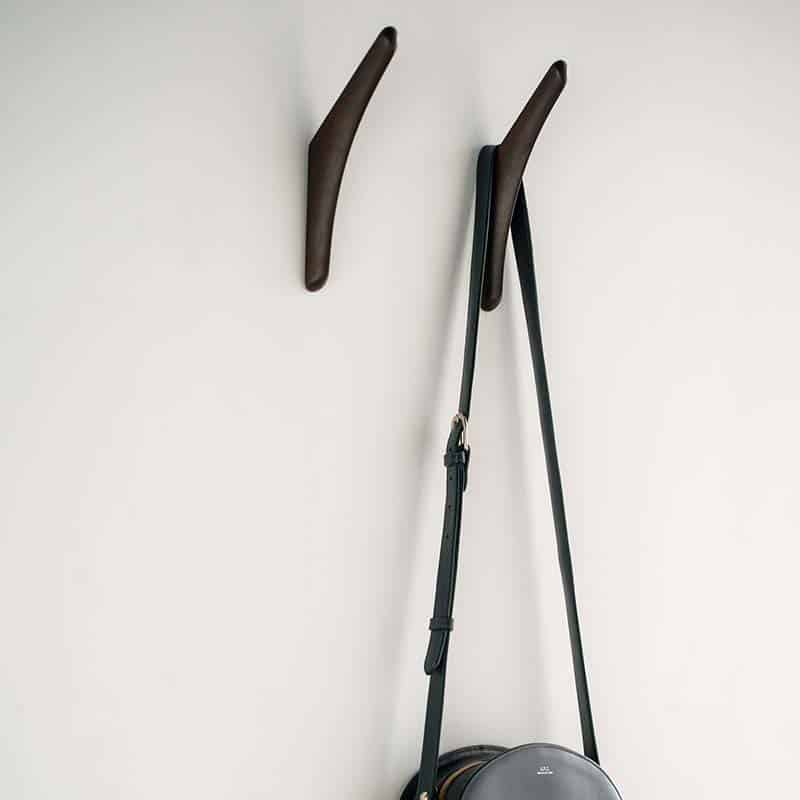 Ethnicraft PI Wall Hangers Dark Mahogany Lifestyle Shot 01 Olson and Baker - Designer & Contemporary Sofas, Furniture - Olson and Baker showcases original designs from authentic, designer brands. Buy contemporary furniture, lighting, storage, sofas & chairs at Olson + Baker.
