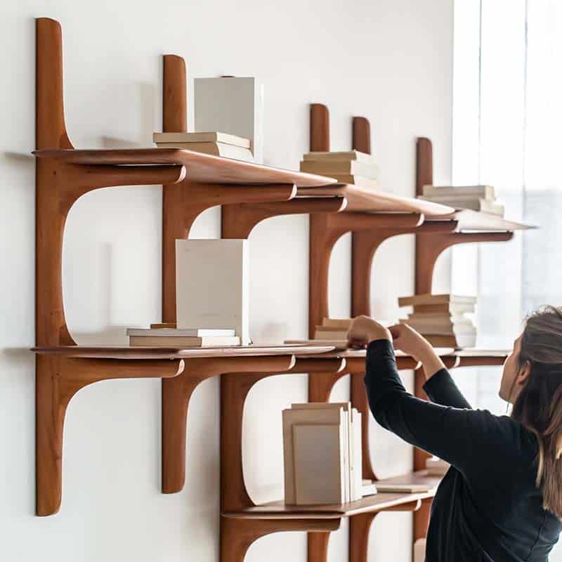 Ethnicraft PI Wall Shelf Mahogany Lifestyle Shot 01 Olson and Baker - Designer & Contemporary Sofas, Furniture - Olson and Baker showcases original designs from authentic, designer brands. Buy contemporary furniture, lighting, storage, sofas & chairs at Olson + Baker.
