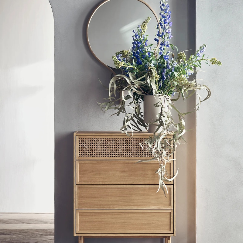 Bolia - Cana Rattan Chest of Drawers - Lifestyle image 01 Olson and Baker - Designer & Contemporary Sofas, Furniture - Olson and Baker showcases original designs from authentic, designer brands. Buy contemporary furniture, lighting, storage, sofas & chairs at Olson + Baker.